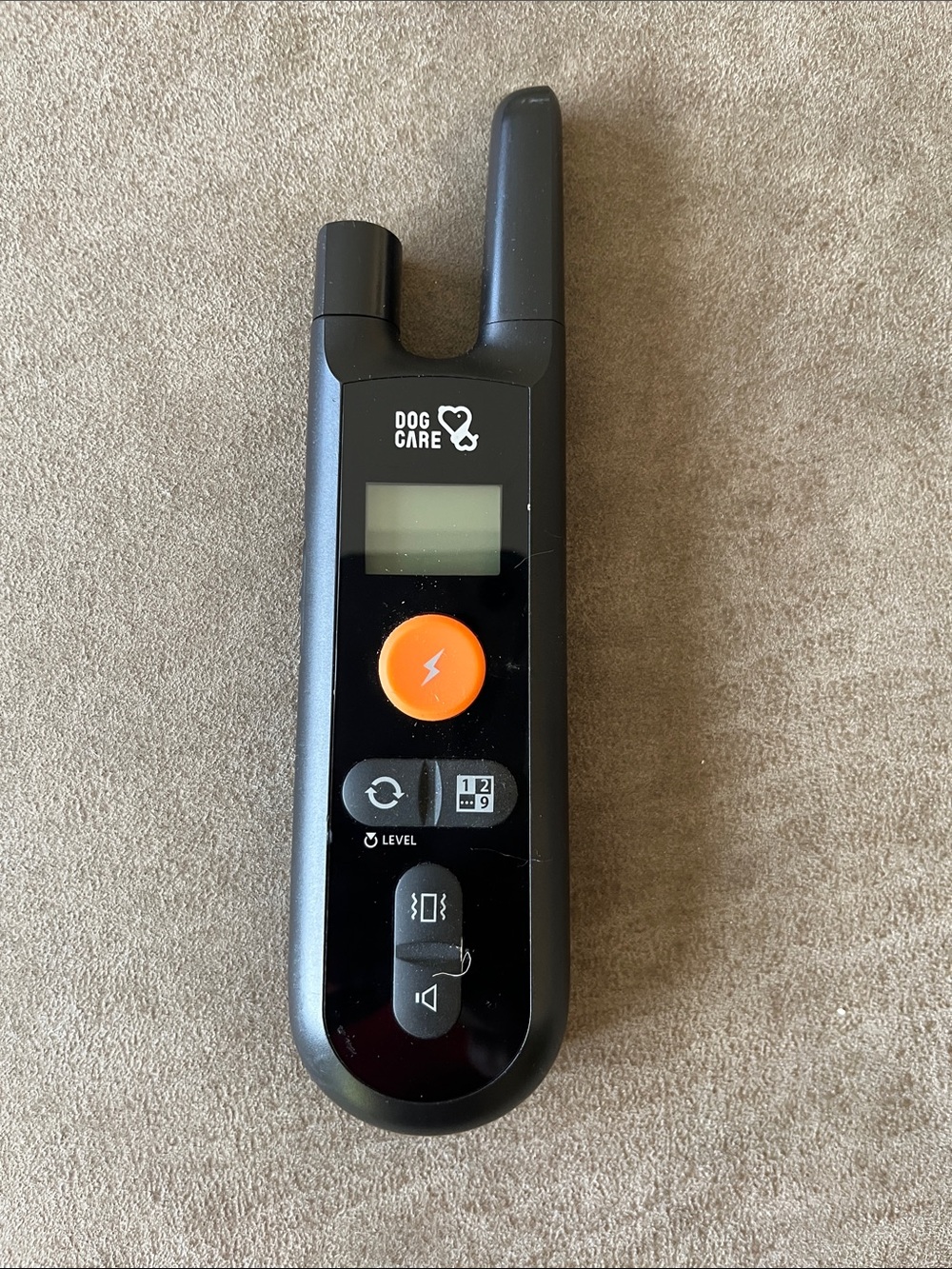 Black Portable Dog Training Remote with Orange Button